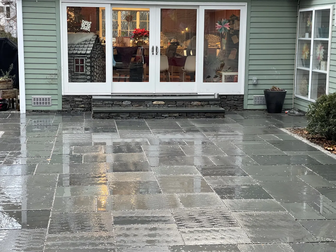 Finished natural stone patio by Roots 'n Shoots